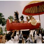 The procession for enstoolment of Chief Nana Kobena Kannie I, featuring a carried seat and red umbrella